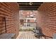 Private patio with brick walls, outdoor seating, and views of the surrounding buildings at 387 Ralph Mcgill Ne Blvd # K, Atlanta, GA 30312