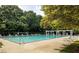 Inviting outdoor pool area, perfect for summer relaxation, with lounge chairs and a trellised area at 387 Ralph Mcgill Ne Blvd # K, Atlanta, GA 30312