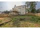 A spacious backyard featuring a wooden deck, grass and a newly constructed fence for privacy at 422 Inwood Trail Trl, Lawrenceville, GA 30043