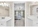 A bathroom opens to a bedroom with double vanities and neutral paint at 422 Inwood Trail Trl, Lawrenceville, GA 30043