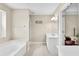 En-suite bathroom featuring a large soaking tub, vanity and walk in shower at 422 Inwood Trail Trl, Lawrenceville, GA 30043