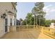 Exterior shot of wooden deck with wood railing overlooking wooded back yard at 422 Inwood Trail Trl, Lawrenceville, GA 30043