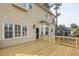 Exterior shot of wooden deck with wood railing overlooking wooded back yard at 422 Inwood Trail Trl, Lawrenceville, GA 30043
