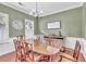 Traditional dining room featuring a chandelier, wainscotting and a large table at 422 Inwood Trail Trl, Lawrenceville, GA 30043
