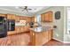 Bright kitchen with custom wood cabinetry, a tiled backsplash, and modern black appliances at 422 Inwood Trail Trl, Lawrenceville, GA 30043