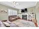Well-lit living room boasting a fireplace, built-in shelves, and cozy seating area at 422 Inwood Trail Trl, Lawrenceville, GA 30043