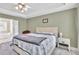 A Primary bedroom features lots of natural light, neutral colors, and plush carpet at 422 Inwood Trail Trl, Lawrenceville, GA 30043