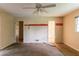 Bedroom has a ceiling fan, carpet, and two doorways at 4715 Wildginger Run, Lithonia, GA 30038
