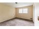 A standard bedroom featuring a window allowing natural light to filter in at 4715 Wildginger Run, Lithonia, GA 30038