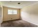 Standard bedroom featuring a window allowing natural light to filter in at 4715 Wildginger Run, Lithonia, GA 30038
