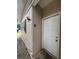 Side exterior of home with a window and white door at 4715 Wildginger Run, Lithonia, GA 30038