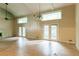 Spacious living room featuring hardwood floors and large windows providing ample natural light at 4715 Wildginger Run, Lithonia, GA 30038