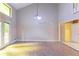 Open living space with french doors, chandelier, and hardwood floors at 4715 Wildginger Run, Lithonia, GA 30038