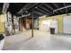 Unfinished basement with exposed ducts, lighting, and laundry area at 6085 Dunbritan Ln, Atlanta, GA 30349