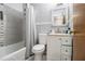 Bathroom featuring a shower-tub combination, neutral walls and flooring, and vanity at 6085 Dunbritan Ln, Atlanta, GA 30349