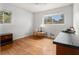 This bedroom features hardwood floors, neutral walls, and windows bringing in natural light at 6085 Dunbritan Ln, Atlanta, GA 30349
