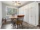 Cozy dining area featuring laminate floors, with built-in storage and bright lighting at 6085 Dunbritan Ln, Atlanta, GA 30349