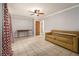 Cozy living room with tile flooring, a ceiling fan and access to other rooms at 6085 Dunbritan Ln, Atlanta, GA 30349