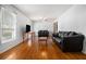 Spacious living room features hardwood floors and lots of natural light at 6085 Dunbritan Ln, Atlanta, GA 30349