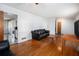 Comfortable living room offers hardwood floors and an open floor plan at 6085 Dunbritan Ln, Atlanta, GA 30349