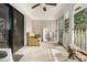 This screened porch has brick walls, ceiling fan, and space for seating at 6085 Dunbritan Ln, Atlanta, GA 30349