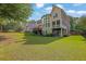 Expansive backyard with a well-maintained lawn, offering plenty of space for recreation and relaxation at 6260 Sturbridge Ln, Cumming, GA 30040