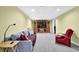 Cozy basement with comfortable seating, a large entertainment center, and plush carpeting at 6260 Sturbridge Ln, Cumming, GA 30040