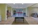 Basement featuring a ping pong table and additional entertainment space that includes a sofa and accent chairs at 6260 Sturbridge Ln, Cumming, GA 30040