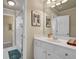 Bright bathroom features a white vanity, and a shower-tub combo, offering a functional and stylish space at 6260 Sturbridge Ln, Cumming, GA 30040