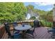 Inviting deck with comfortable seating and a grill, ideal for outdoor dining and entertaining guests at 6260 Sturbridge Ln, Cumming, GA 30040