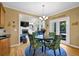 Charming dining area adjacent to the kitchen with elegant decor and access to the patio at 6260 Sturbridge Ln, Cumming, GA 30040
