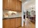 Elegant dining area with wood floors, ample storage, and a view into an additional dining space at 6260 Sturbridge Ln, Cumming, GA 30040