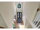 Grand foyer with high ceilings, elegant double doors, hardwood floors, and a stylish chandelier at 6260 Sturbridge Ln, Cumming, GA 30040