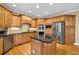 Well-equipped kitchen with stainless steel appliances, granite counters, and stylish cabinetry at 6260 Sturbridge Ln, Cumming, GA 30040