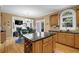 Kitchen with granite countertops, stainless appliances, wine rack and an open design to living space at 6260 Sturbridge Ln, Cumming, GA 30040