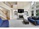 Cozy living area with a fireplace, built-in bookshelves, and ample natural light at 6260 Sturbridge Ln, Cumming, GA 30040