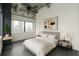 Bright bedroom features a large window overlooking the city, contemporary art, and a ceiling fan at 120 Ralph Mcgill Ne Blvd # 1502, Atlanta, GA 30308