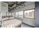Bright bedroom features ceiling fan, large windows with a city view, and exposed ductwork at 120 Ralph Mcgill Ne Blvd # 1502, Atlanta, GA 30308