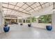Entrance with blue potted plants, grey stone floors, and a covered awning for the community at 120 Ralph Mcgill Ne Blvd # 1502, Atlanta, GA 30308