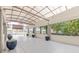 Entrance with grey stone floors, blue potted plants, and covered awning for the community at 120 Ralph Mcgill Ne Blvd # 1502, Atlanta, GA 30308
