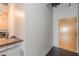 Hallway leads to door, kitchen area with stainless appliances, and modern design at 120 Ralph Mcgill Ne Blvd # 1502, Atlanta, GA 30308