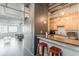Open-concept kitchen with breakfast bar, modern appliances, and industrial-style ceiling at 120 Ralph Mcgill Ne Blvd # 1502, Atlanta, GA 30308