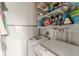 Laundry area equipped with a washer, dryer, and storage shelving at 120 Ralph Mcgill Ne Blvd # 1502, Atlanta, GA 30308
