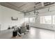 Modern living room featuring a ceiling fan, industrial ceilings, and expansive windows with city views at 120 Ralph Mcgill Ne Blvd # 1502, Atlanta, GA 30308