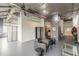 Open living space featuring exposed ductwork, dark accent wall, and gray walls at 120 Ralph Mcgill Ne Blvd # 1502, Atlanta, GA 30308