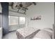 Bedroom with industrial accents, a large window overlooking city views, and modern decor at 120 Ralph Mcgill Ne Blvd # 1502, Atlanta, GA 30308
