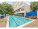 Relaxing community pool with clear blue water and plenty of seating for residents at 120 Ralph Mcgill Ne Blvd # 1502, Atlanta, GA 30308