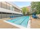 A clean, sparkling outdoor swimming pool surrounded by lounge chairs, perfect for relaxation and recreation at 120 Ralph Mcgill Ne Blvd # 1502, Atlanta, GA 30308