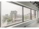 Large windows offer an impressive city view with highway and skyline in the background at 120 Ralph Mcgill Ne Blvd # 1502, Atlanta, GA 30308