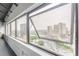 Open window showcases expansive city views featuring highways and iconic buildings at 120 Ralph Mcgill Ne Blvd # 1502, Atlanta, GA 30308
